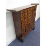 An early 20th century Oriental metal-mounted wooden cabinet; possibly Korean, forty-two varying