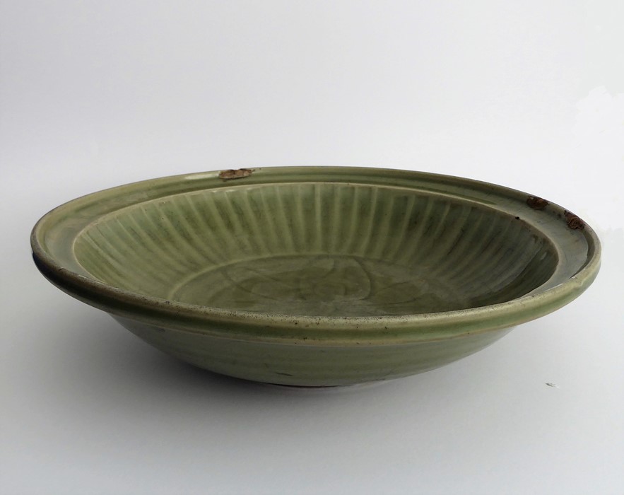 A large early 17th century Chinese Longquan bowl with celadon glaze; the moulded lip above a - Image 2 of 5