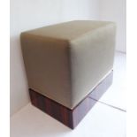 A J. Robert Scott, Inc. Ventana ottoman; the plain upholstered seat above a rectangular rosewood