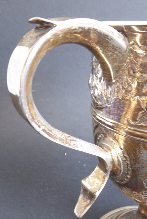 An 18th century hallmarked silver two-handled trophy-style cup; later Repoussé decorated and with - Image 11 of 11