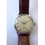 A gentleman's Omega Seamaster steel-cased wristwatch; the signed dial with baton markers and
