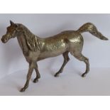 A heavy early 20th century/Art Deco period cast silver-plated model of a stallion standing four
