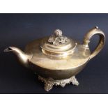 A hallmarked silver teapot with a budding flower as the finial; of squat form, maker's mark RP GB,