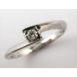 A solitaire diamond ring, the stone set in a white gold ring marked 10K (total weight 1.6g,