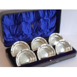 A fine set of six hallmarked silver bowls; crimped edges, retailer's mark of 'Arnold & Lewis,