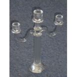 A fine hand-cut three light crystal table candelabra; fluted stem and on facet-cut angular base (