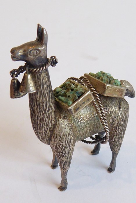 An unusual solid silver model of a Llama/Alpaca laden with two boxes of precious minerals; the beast