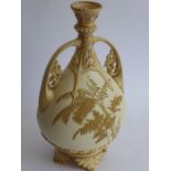 A late 19th century Worcester blush porcelain vase; flaring reticulated top above two ornate handles