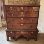 An early 18th century walnut chest-on-stand; three top drawers above three further full-width