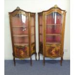 A good pair of late 19th / early 20th century Louis-XV-style walnut vitrines: gilt-metal-mounted and