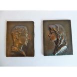 A pair of late 19th/early 20th century patinated bronze shoulder-length portrait studies in