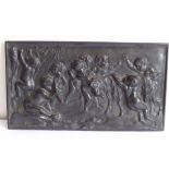 A 19th century cast-iron rectangular plaque; decorated with cherubic figures partaking in