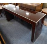 A fine and stylish rosewood and chrome-bordered console/centre table of rectangular form; raised