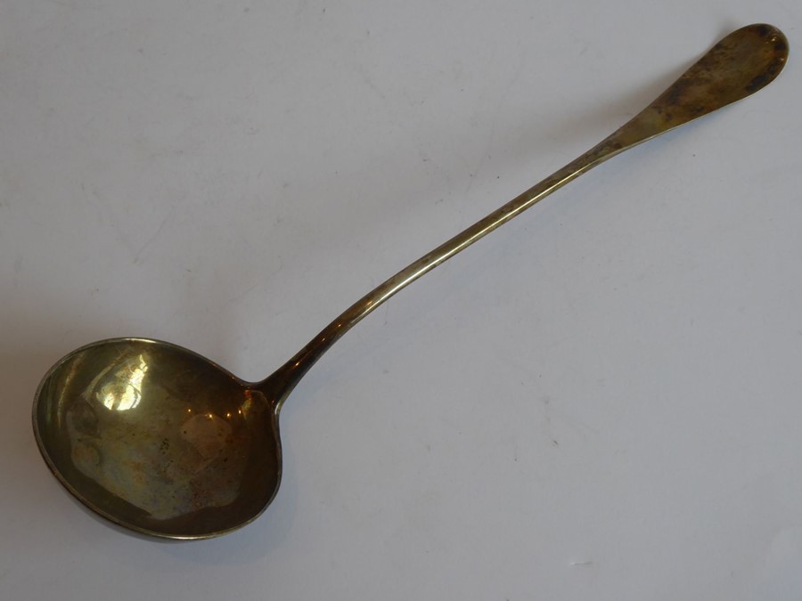 An 18th century Georgian silver ladle with engraved armorial (both armorial and hallmarks rubbed),