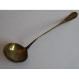 An 18th century Georgian silver ladle with engraved armorial (both armorial and hallmarks rubbed),