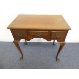 An early 20th century walnut lowboy in mid-18th century George-II-style; the moulded top with re-