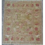 A light-mustard ground rug; possibly Karabagh, early to mid 20th century, with a design of red roses