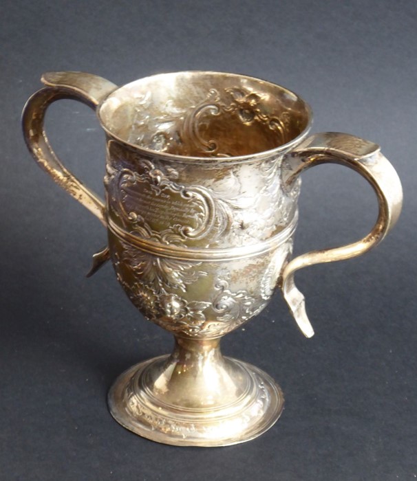 An 18th century hallmarked silver two-handled trophy-style cup; later Repoussé decorated and with - Image 2 of 11