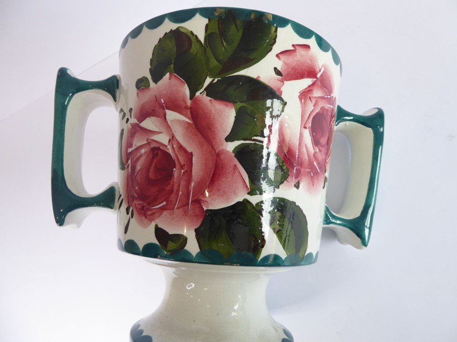 An early 20th century two-handled Wemyss Pottery loving cup; hand-decorated with roses, stamped - Image 6 of 6