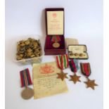 Approximately 100 early 20th century Royal Navy brass buttons, four British WW2 medals and a boxed