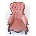 A large mid-19th century grandfather chair; mahogany-framed, button back upholstered, spoon-back.