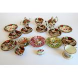 A selection of 19th century miniature cups, saucers, a sugar bowl, teapot, miniature two-handled