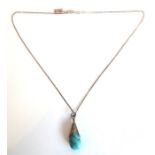 A pear-shaped silver pendant mounted with a polished blue cabochon turquoise stone (boxed)