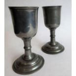 A pair of pewter goblets in early 18th century style and with circular spreading feet (18cm high)