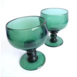 A pair of large and heavy 19th century Roamer-style green-glass drinking glasses; each handmade