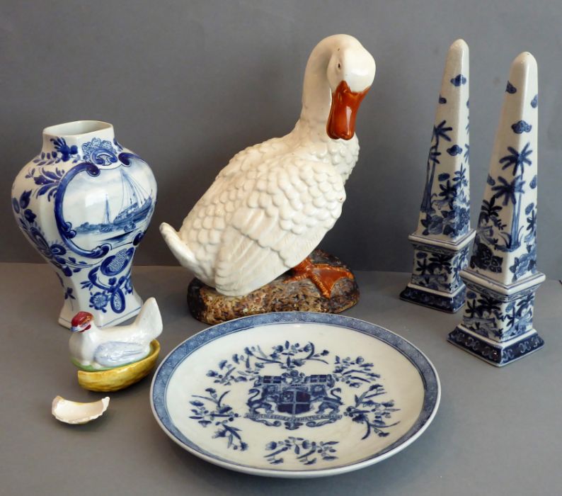 Five pieces comprising an East India Company armorial plate, an 18th-century-style Delft pottery