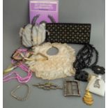 An assortment of jewellery and other items to include an early 20th century lady's purse set with