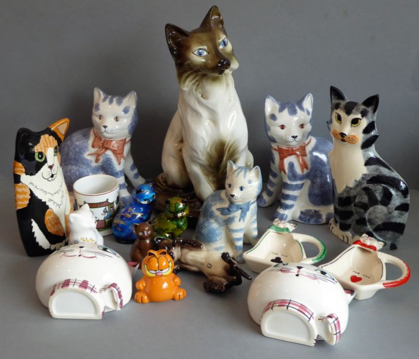 Sixteen ceramic cat models to include three blue-and-white Rye Pottery examples, one by Beswick and