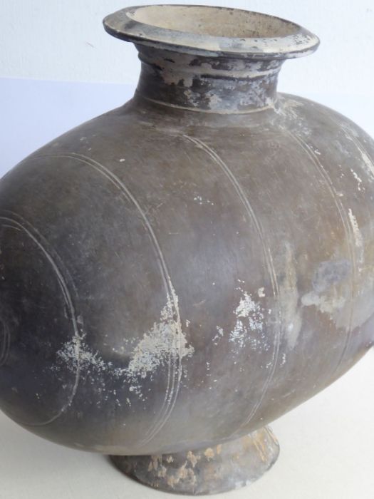 A Chinese Han Dynasty (206 BC - AD 220) incised cocoon jar. Grey, flared circular neck with - Image 6 of 10