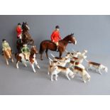 A hand-decorated Beswick porcelain hunting group: two in Pink, two children in ratcatchers and ten