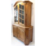 A late 19th / early 20th century French oak buffet à deux corps; the domed top above two shaped