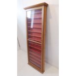 A single pine wall mounted display cabinet with shelves (152cm tall x 12cm deep x 59cm wide)