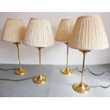 A set of four brass table lamps with conical-shaped pleated shades (54cm high including shades)