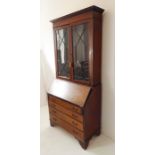 An Edwardian mahogany, boxwood-strung and satinwood-crossbanded bureau bookcase; the outset