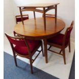 A mid-20th century Scandinavian-style oval teak extending dining table and a set of four dining