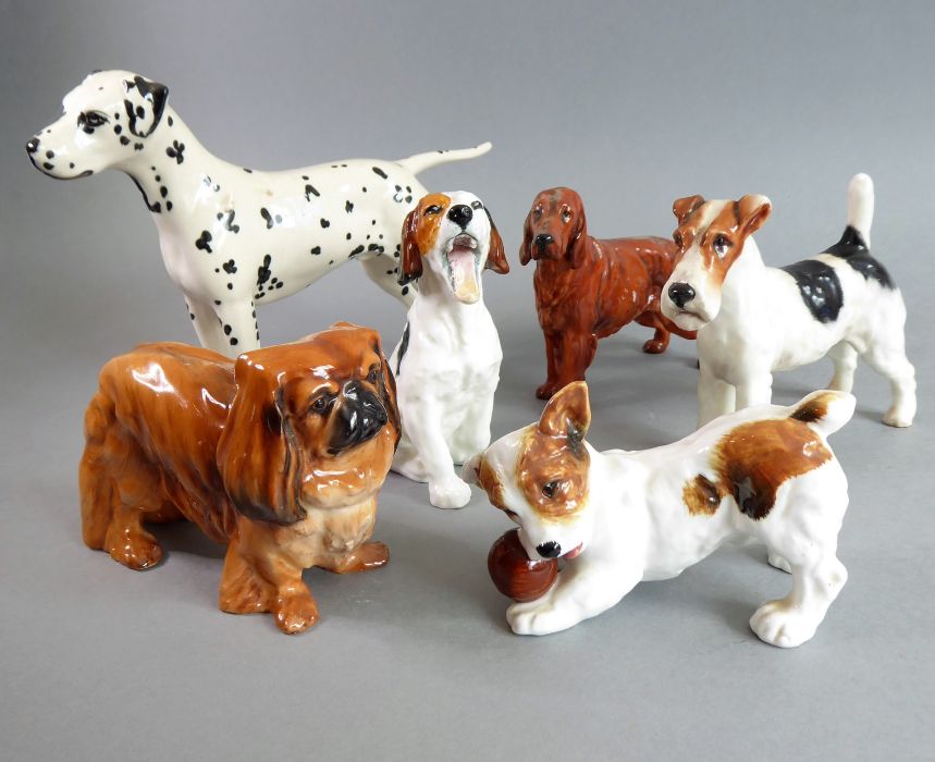 Six hand-decorated Royal Doulton porcelain dogs: Pekinese, Irish Setter, Jack Rusell with ball (