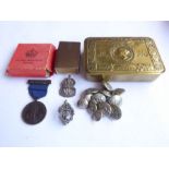 A Princess Mary Gift Box and its contents: a silver Air Raid Precautions badge and a set of ARP