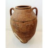 An antique two-handled Greek-style terracotta amphora (58cm high x 35cm including handles)