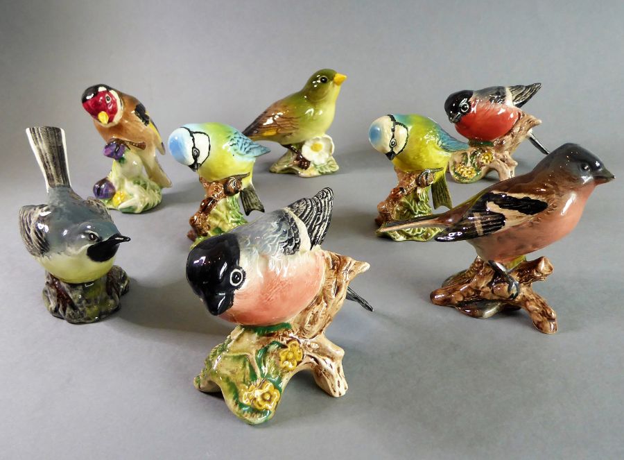 Eight hand-decorated Beswick birds: Bullfinch (x 2), Blue Tit (x 2), Goldfinch, Greenfinch,