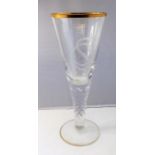 A large and heavy 19th century conical-shaped drinking glass; gilded rim above an etched monogram '