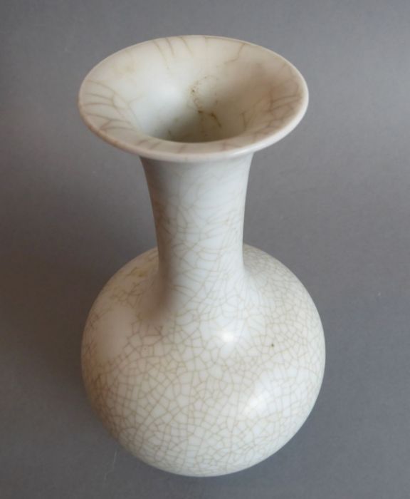 A heavy Chinese porcelain bottle-shaped crackleware vase; inverted rim above a tall slender neck and - Image 3 of 4