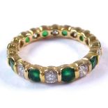 An 18-carat gold, emerald and diamond full eternity ring; ring size K/L