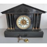 A large late 19th century black slate eight-day mantle clock; the gilded movement signed 'Ansonia,