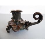 A 19th century patinated bronze chamberstick in Grand Tour style (12cm long)
