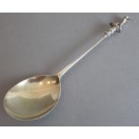 A large Edwardian silver golf-themed presentation spoon with gilded bowl; the finial of a cast