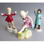 Three hand-decorated Royal Worcester calendar figures modelled by F. G Doughty: January, February